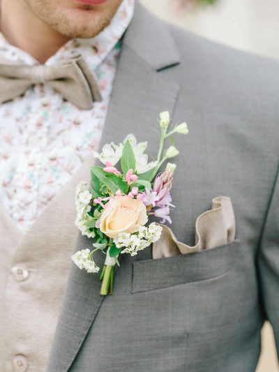 Lapel flowers or corsage for a groom in pastel colours for seven suits